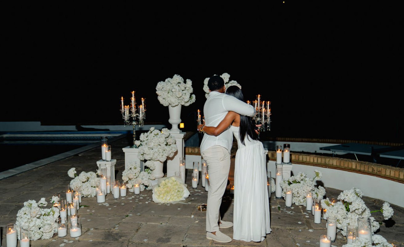 An embrace among the candles