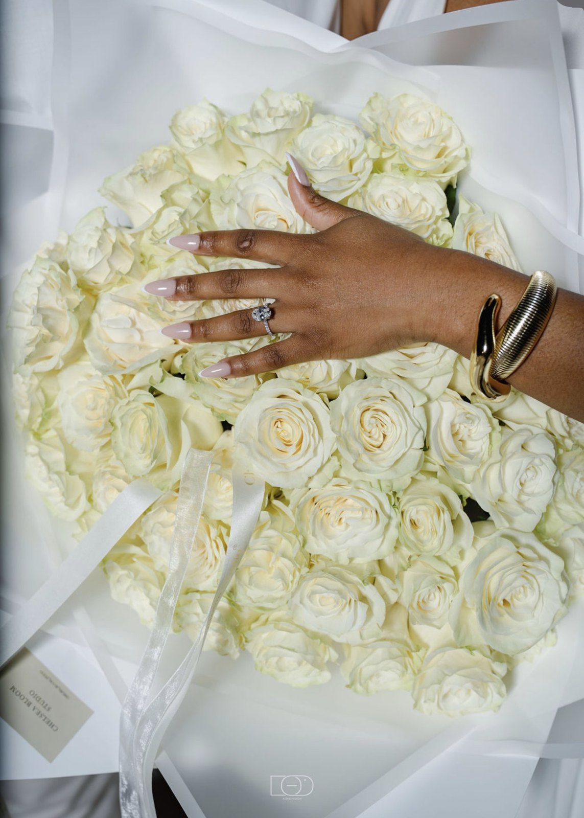 The ring on a bouquet of white roses